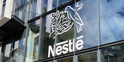 Nestlé logo on the facade of Nestlé France headquarters building near Paris, France