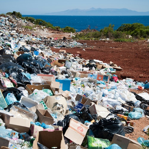 A dump of packaging by the sea