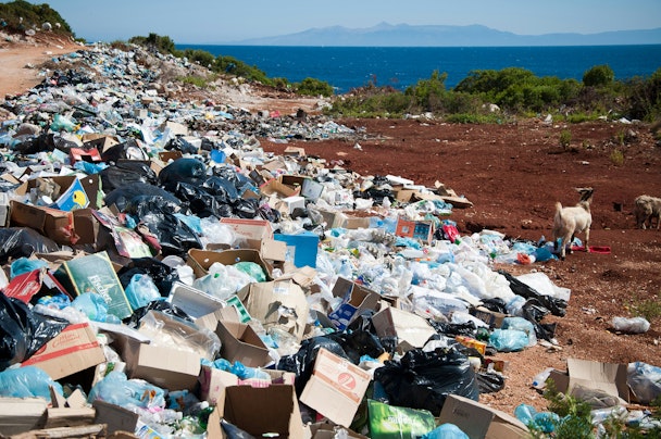 A dump of packaging by the sea