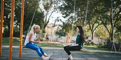 Women on swing set