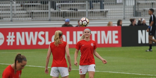 Two women playing football