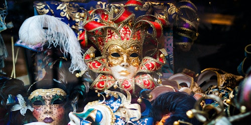 A pile of fancy masks, of the kind associated with Venetian balls