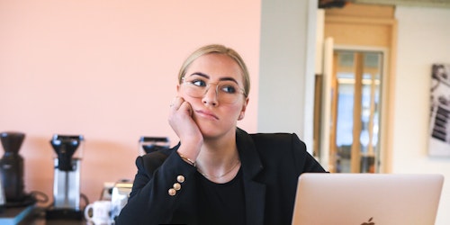 A young woman bored at work