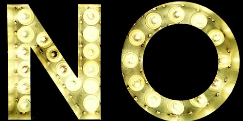 Yellow lightbulbs spell out the word 'no' against a black background