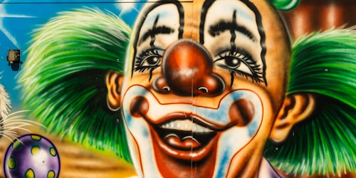 A giant multi-color mural of a clown