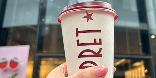 A woman enjoying a Pret coffee