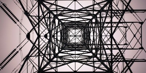 A pylon viewed from below making an abstract pattern