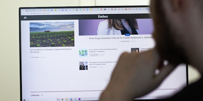 Man looking at Forbes.com