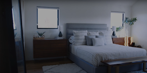 A bedroom in a house being dressed for viewing by homebuyers