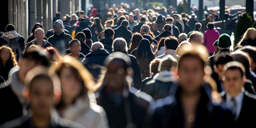 People walking down a busy city street