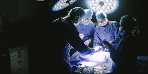 Surgeons looming over a patient